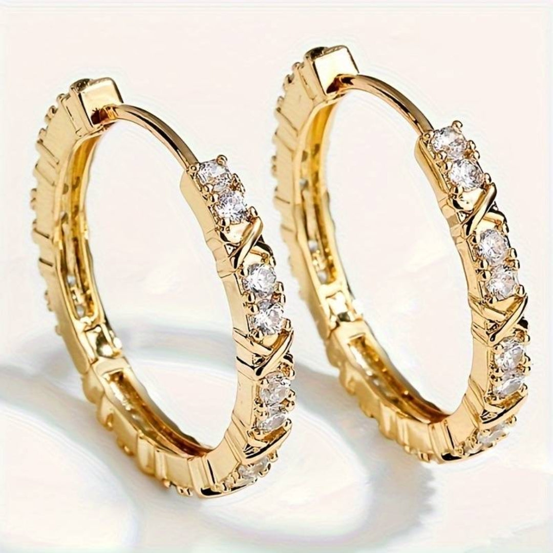 Aretes dorados glamorosos con un brillo radiante