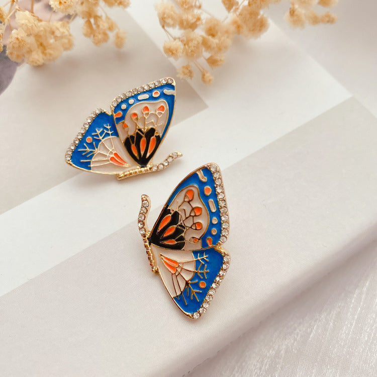 Pendientes de mariposa de esmalte vintage elegantes en azul