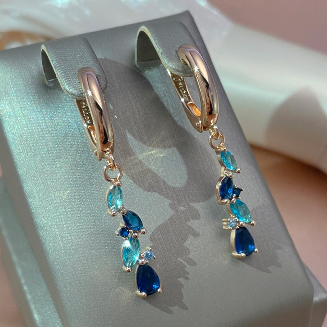 Pendientes fascinantes en azul y oro con cristales brillantes