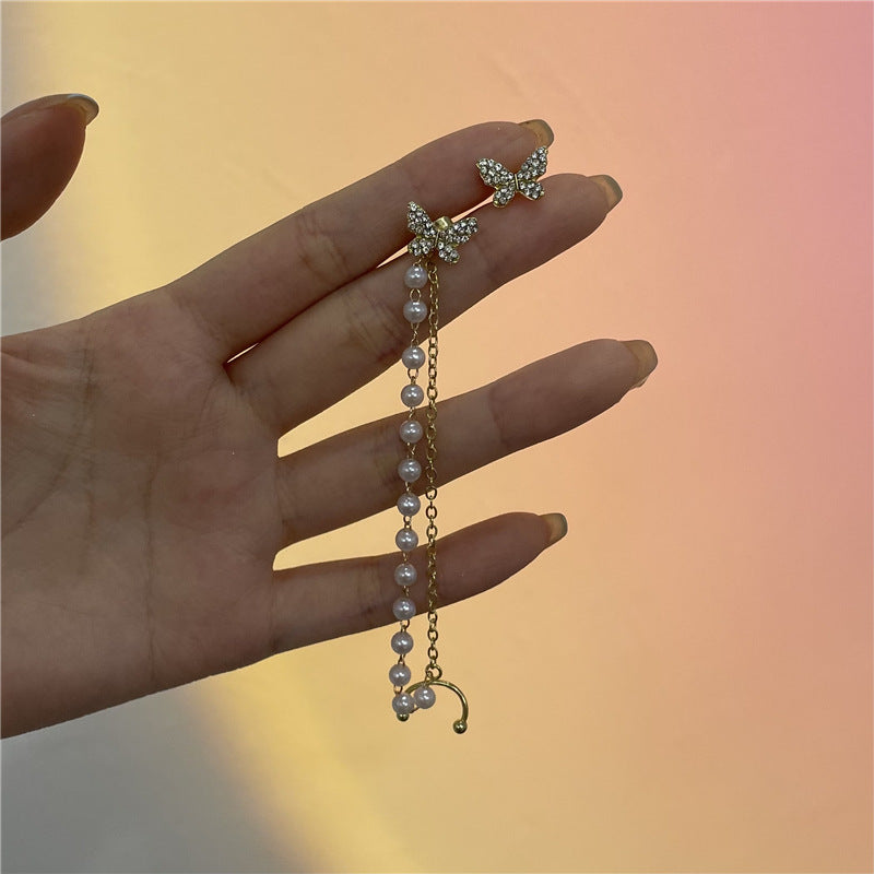 Pendientes de mariposa elegantes con brillantes circonitas y perlas preciosas en oro