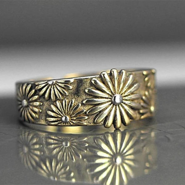 Anillo de oro elegante con diseño de margaritas