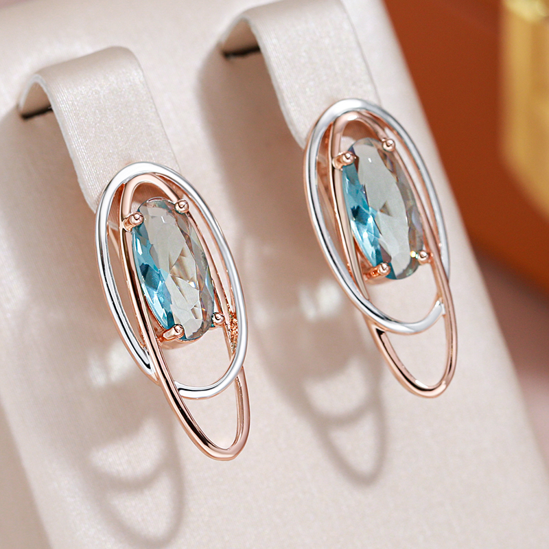 Pendientes lujosos con brillantes cristales turquesa en elegante oro y plata