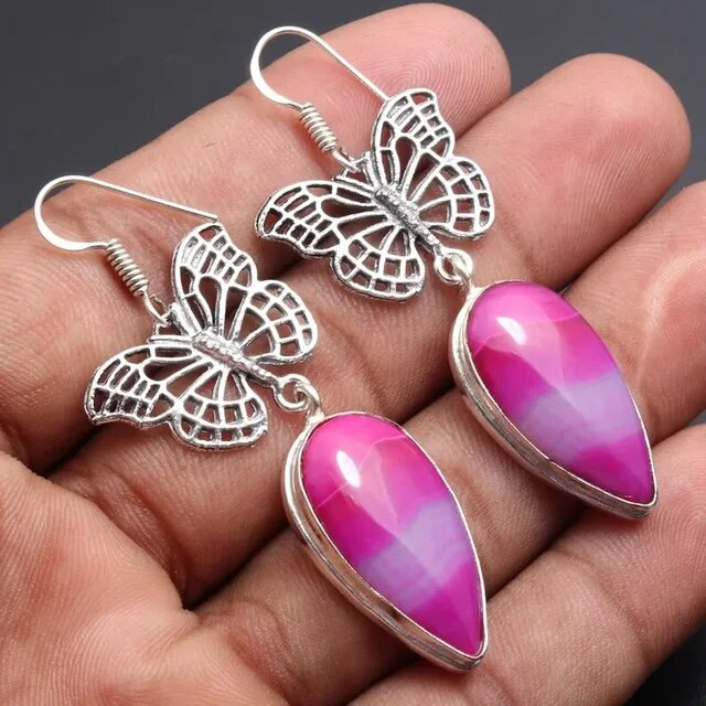 Pendientes vintage de mariposa encantadores con piedra rosa