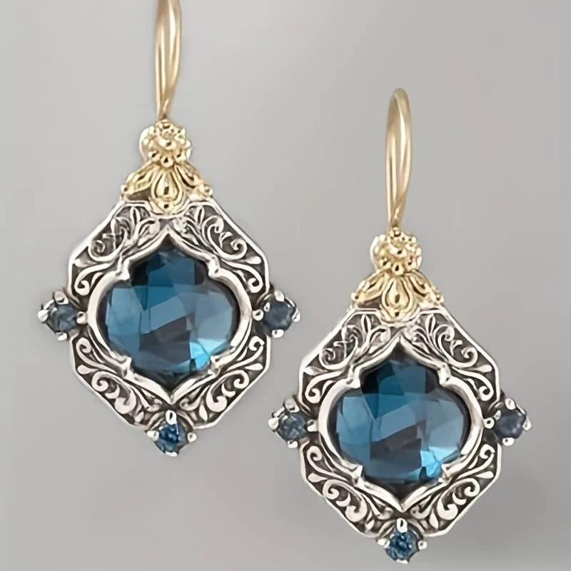 Elegantes pendiente de cristal azul en noble oro y plata