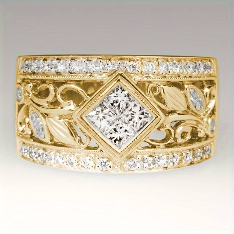 Anillo vintage radiante en elegante diseño dorado