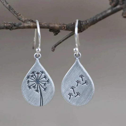 Elegantes aretes de versilberado con motivo de diente de león