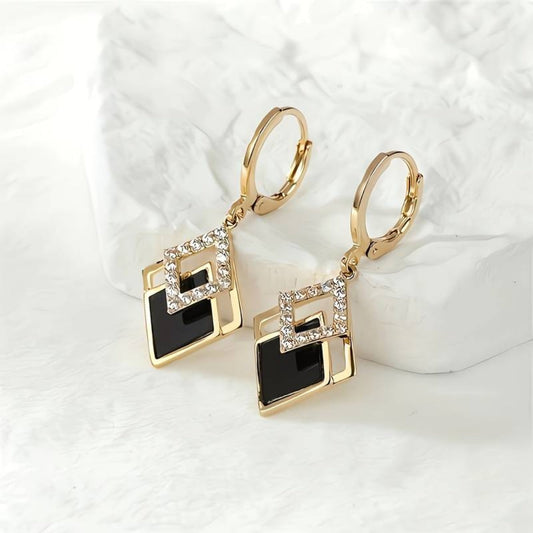Elegantes aretes de oro con negro brillante