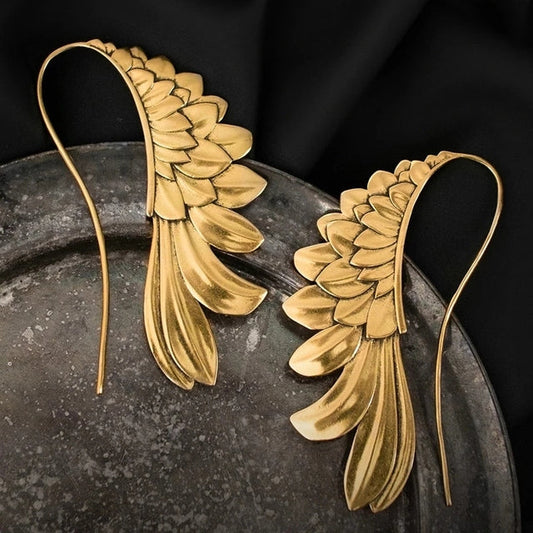 Pendientes vintage artísticos con diseño alado en elegante plata