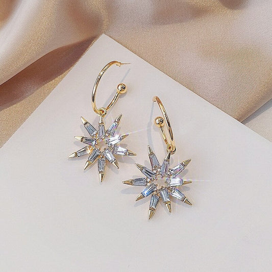 Elegantes pendientes de estrella en oro de alta calidad y plata noble
