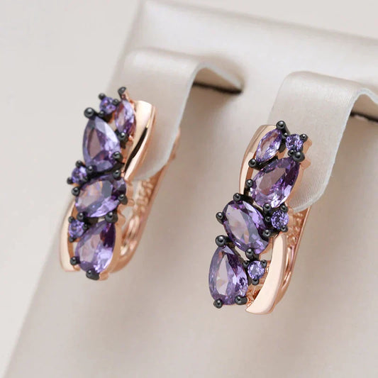 Pendientes de oro delicados con cristal púrpura brillante