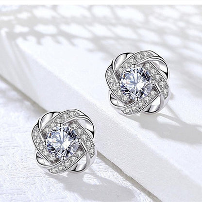 Pendientes cruzados de espiral de flores encantadoras