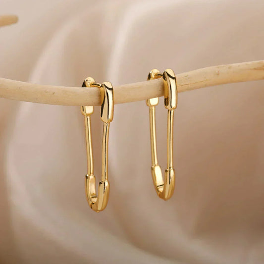 Pendientes de clip elegantes minimalistas en oro