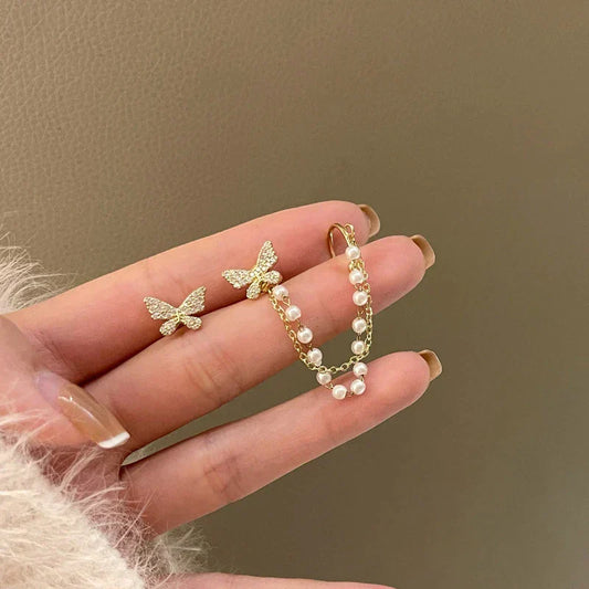 Pendientes de mariposa elegantes con brillantes circonitas y perlas preciosas en oro