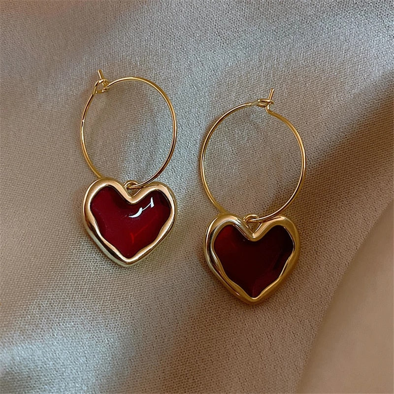 Pendientes de corazón elegantes de oro fino