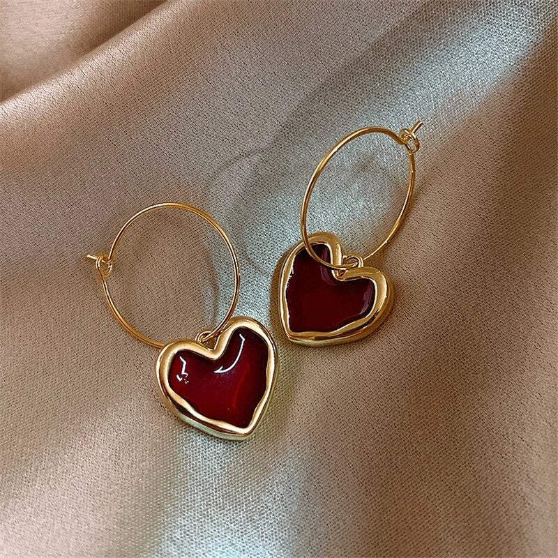 Pendientes de corazón elegantes de oro fino