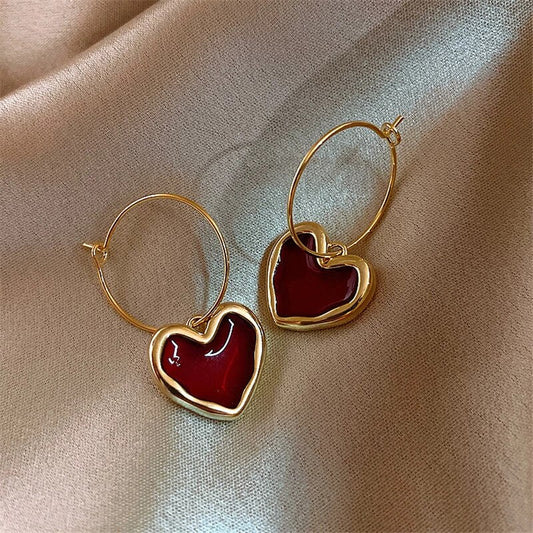 Pendientes de corazón elegantes de oro fino