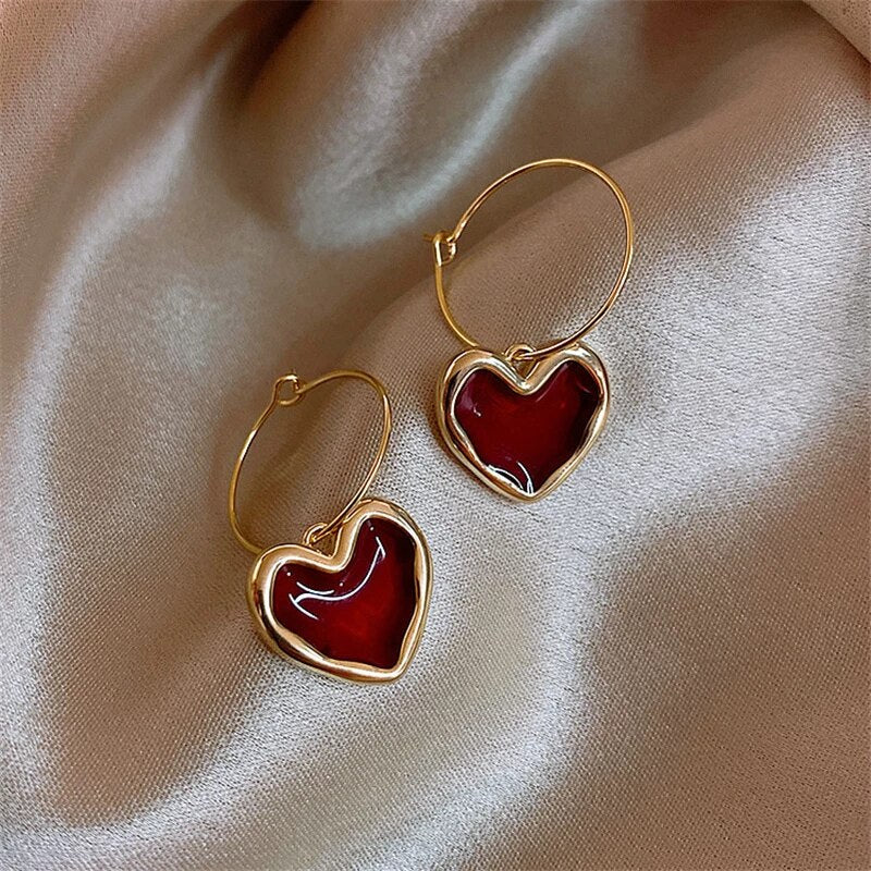 Pendientes de corazón elegantes de oro fino