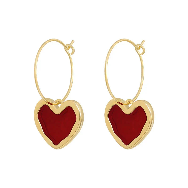 Pendientes de corazón elegantes de oro fino
