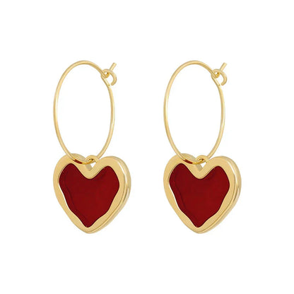 Pendientes de corazón elegantes de oro fino