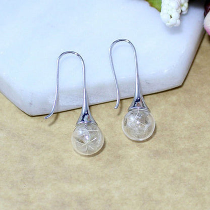 Elegantes pendientes de plata con colgante de diente de león