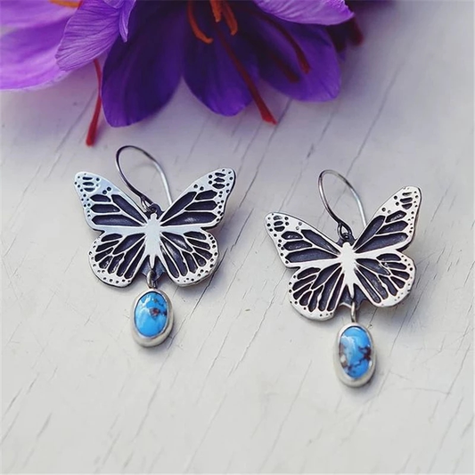 Pendientes Vintage Elegantes de Plata con Piedra Azul y Diseño de Mariposa