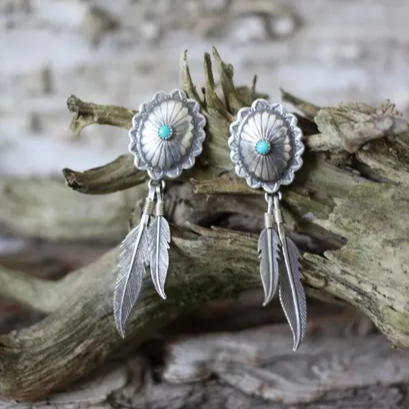 Pendientes de pluma turquesa retro para un toque de boho-chic