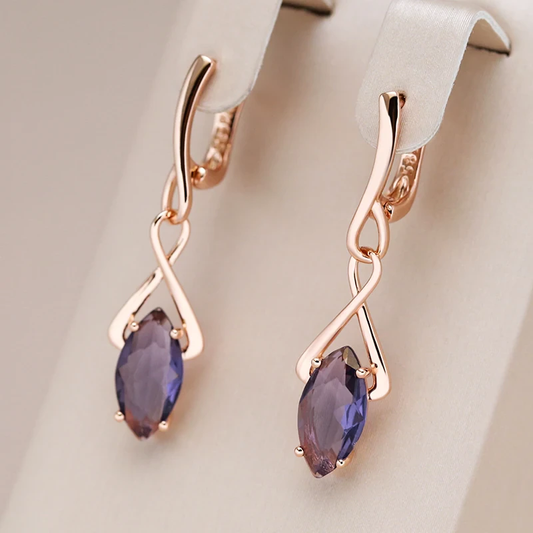 Pendientes encantadores con cristal púrpura brillante